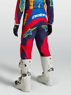 Spodnie cross dziecięce Alpinestars MX Fluid Drag niebiesko-czerwono-żółte