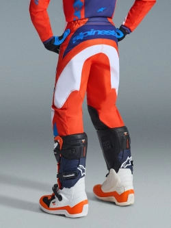 Spodnie cross dziecięce Alpinestars MX Fluid Grid pomarańczowo-biało-niebieskie