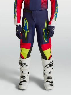 Spodnie cross dziecięce Alpinestars MX Fluid Drag niebiesko-czerwono-żółte