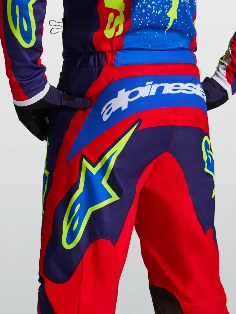 Spodnie cross Alpinestars MX Fluid Drag niebiesko-czerwono-żółte